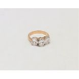 A 9ct gold three stone dress ring, size P. CONDITION REPORT: 3.9g.