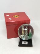 A Shanghai Tang musical snow globe, boxed.