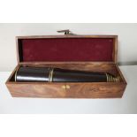 A brass and leather cased nautical telescope in fitted box