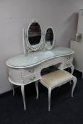 A white French style kidney shaped dressing table with triple mirror and stool