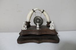 A nineteenth century Anglo Indian ivory mounted desk stand with miniature gong CONDITION