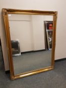 A gilt framed traditional style mirror,