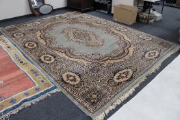 A machine made fringed floral Persian carpet,