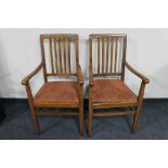 A pair of 20th century oak carver armchairs