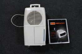 A boxed Challenge heater together with a dehumidifier