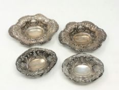 Two pairs of silver repousse dishes