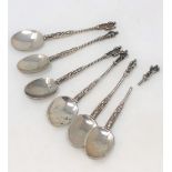 A set of six silver apostle spoons, foreign marks, one with broken finial.