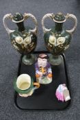 A tray of pair of gilded floral urns, character jug,