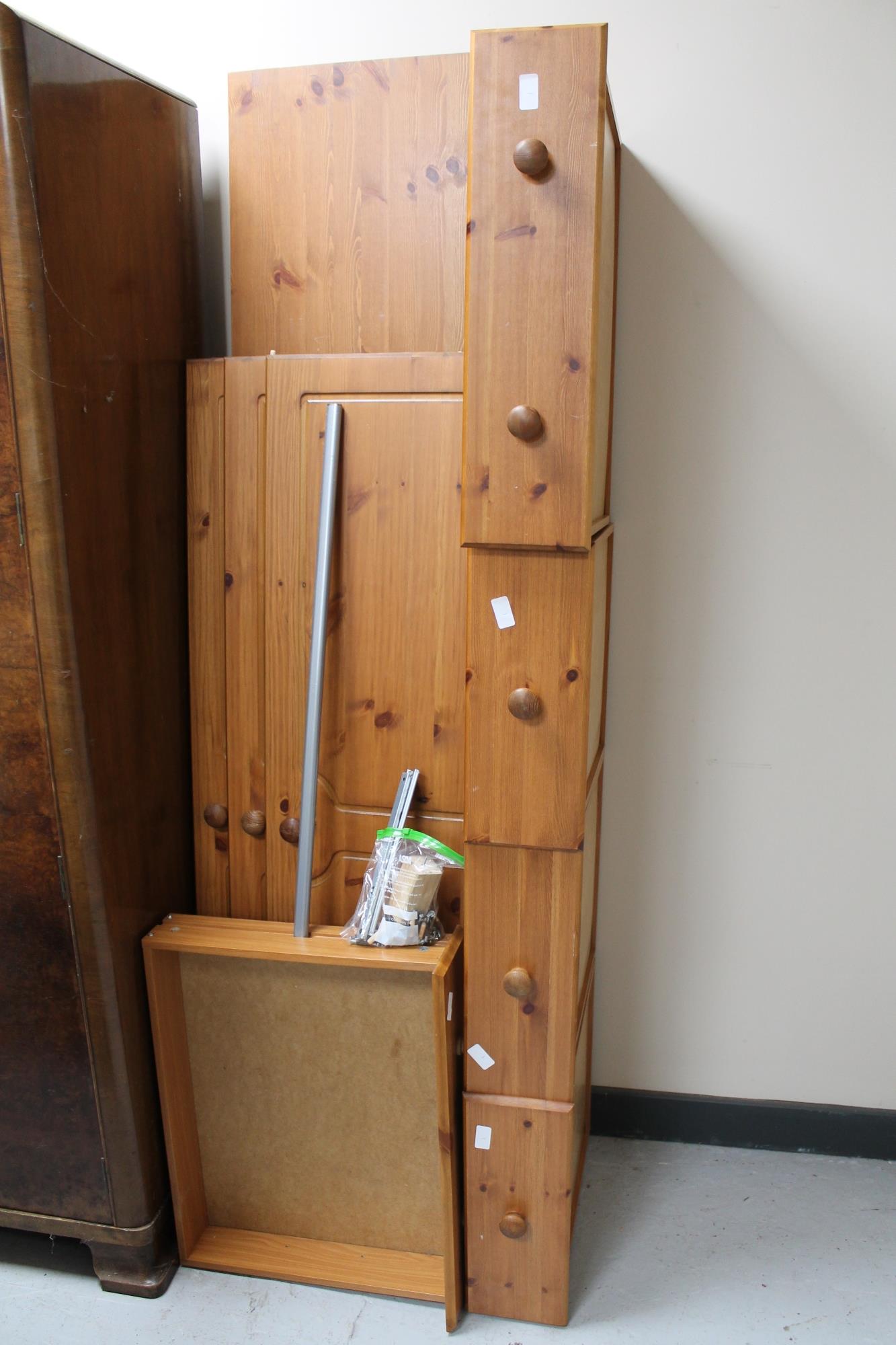 A pine triple door wardrobe fitted five drawers beneath (dismantled)