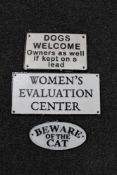 Three cast ion signs - beware of the cat, dogs welcome,