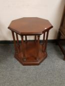 A reproduction octagonal two tier occasional table retailed by Chapmans,