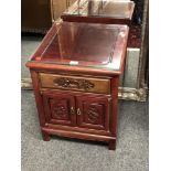 A Chinese hardwood bedside cabinet,