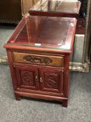 A Chinese hardwood bedside cabinet,