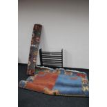 A wooden shoe rack together with two contemporary woolen rugs CONDITION REPORT: The