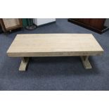 A thick oak refectory coffee table