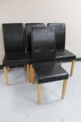 Four contemporary leather upholstered dining chairs