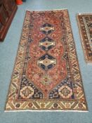 A Persian rug 130 cm x 278 cm