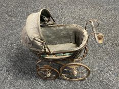 A Victorian style doll's pram