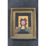 A 20th century religious icon style oil on board of Christ, in heavy gilt frame.