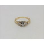 A yellow gold millennium cut diamond ring, the two largest stones G/H colour, Clarity Vs2,