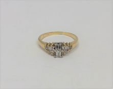 A yellow gold millennium cut diamond ring, the two largest stones G/H colour, Clarity Vs2,