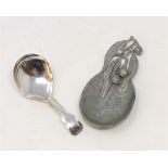 A Georgian silver caddy spoon and an Arts & Crafts pewter caddy spoon.