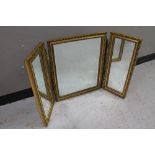 A gilt framed triple mirror