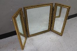 A gilt framed triple mirror