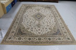 A machine made floral woolen rug on brown ground,