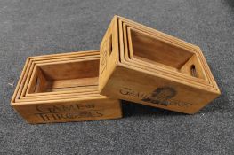 Four graduated wooden Game of Thrones caddies