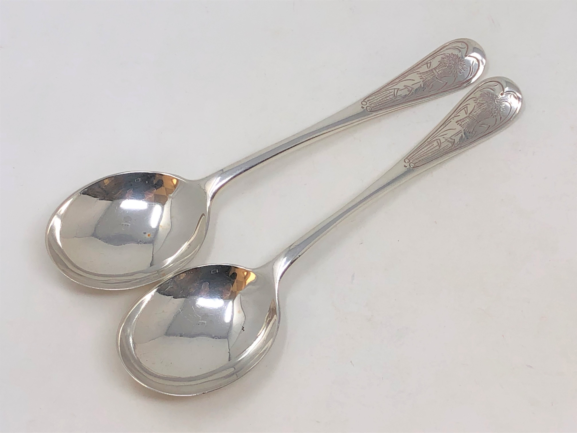 A pair of Victorian silver soup spoons, Charles Boyton, London 1892, 133g gross.