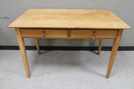 An early 20th century pine kitchen table with two drawers CONDITION REPORT: 122cm