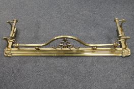 A brass Art Nouveau fire curb CONDITION REPORT: 140cm long by 40cm deep by 26cm