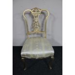 A gilt painted bedroom chair upholstered in classical fabric