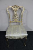 A gilt painted bedroom chair upholstered in classical fabric