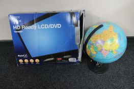 A boxed 19" LCD TV together with a globe