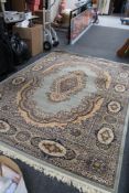 A machine made fringed floral Persian carpet,