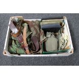 A box of militaria to include leather belts, gun clip, books, notes on Soviet ground force,
