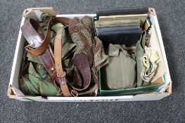 A box of militaria to include leather belts, gun clip, books, notes on Soviet ground force,