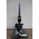 A Metam PB 21 microscope on adjustable stand together with power supply unit