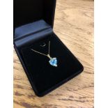 A 10ct yellow gold diamond and topaz pendant on chain