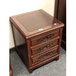 A Chinese hardwood three drawer beside chest,
