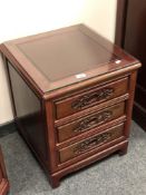 A Chinese hardwood three drawer beside chest,