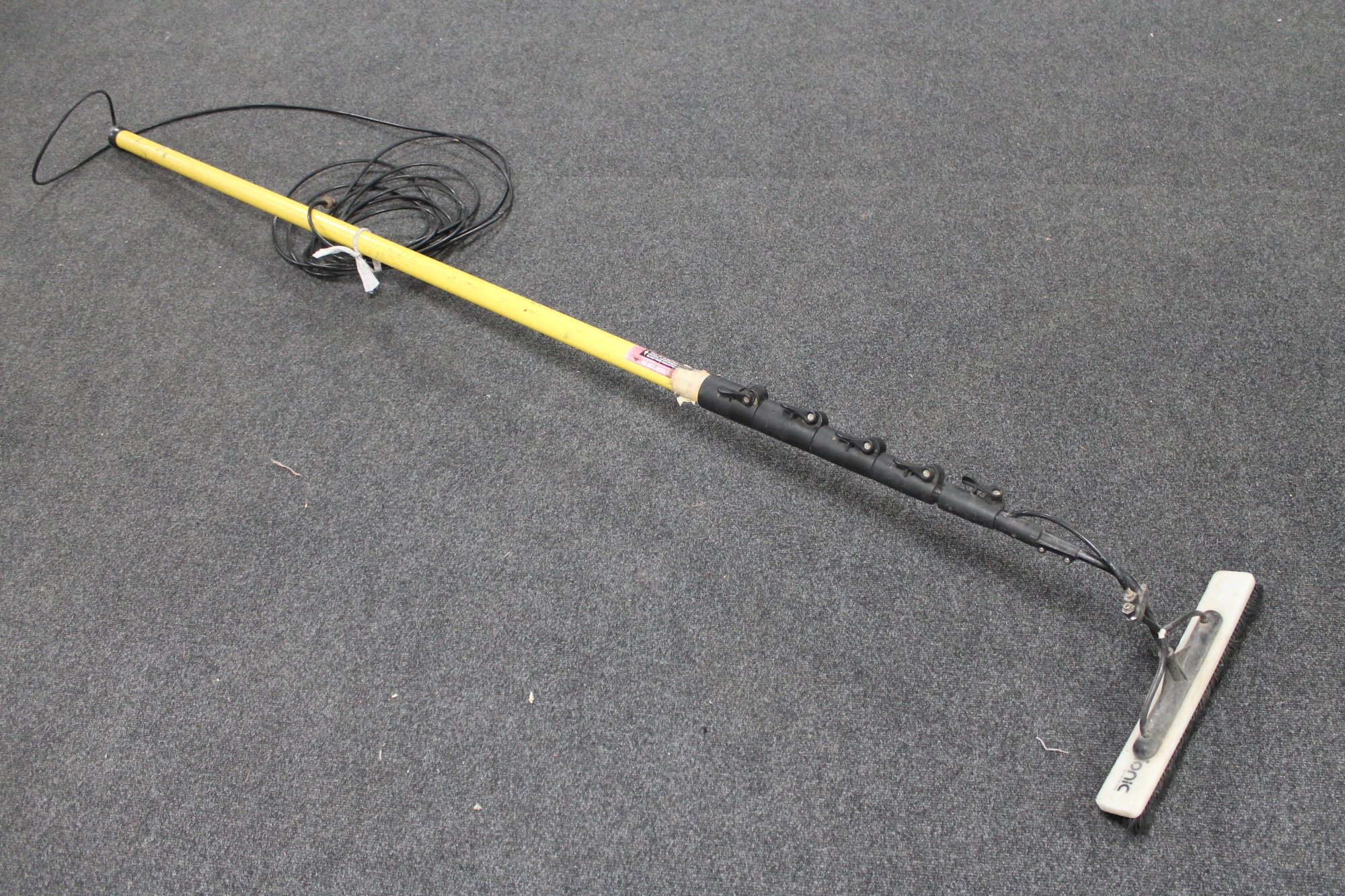 A telescopic long reach window cleaner's pole with brush