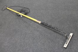 A telescopic long reach window cleaner's pole with brush