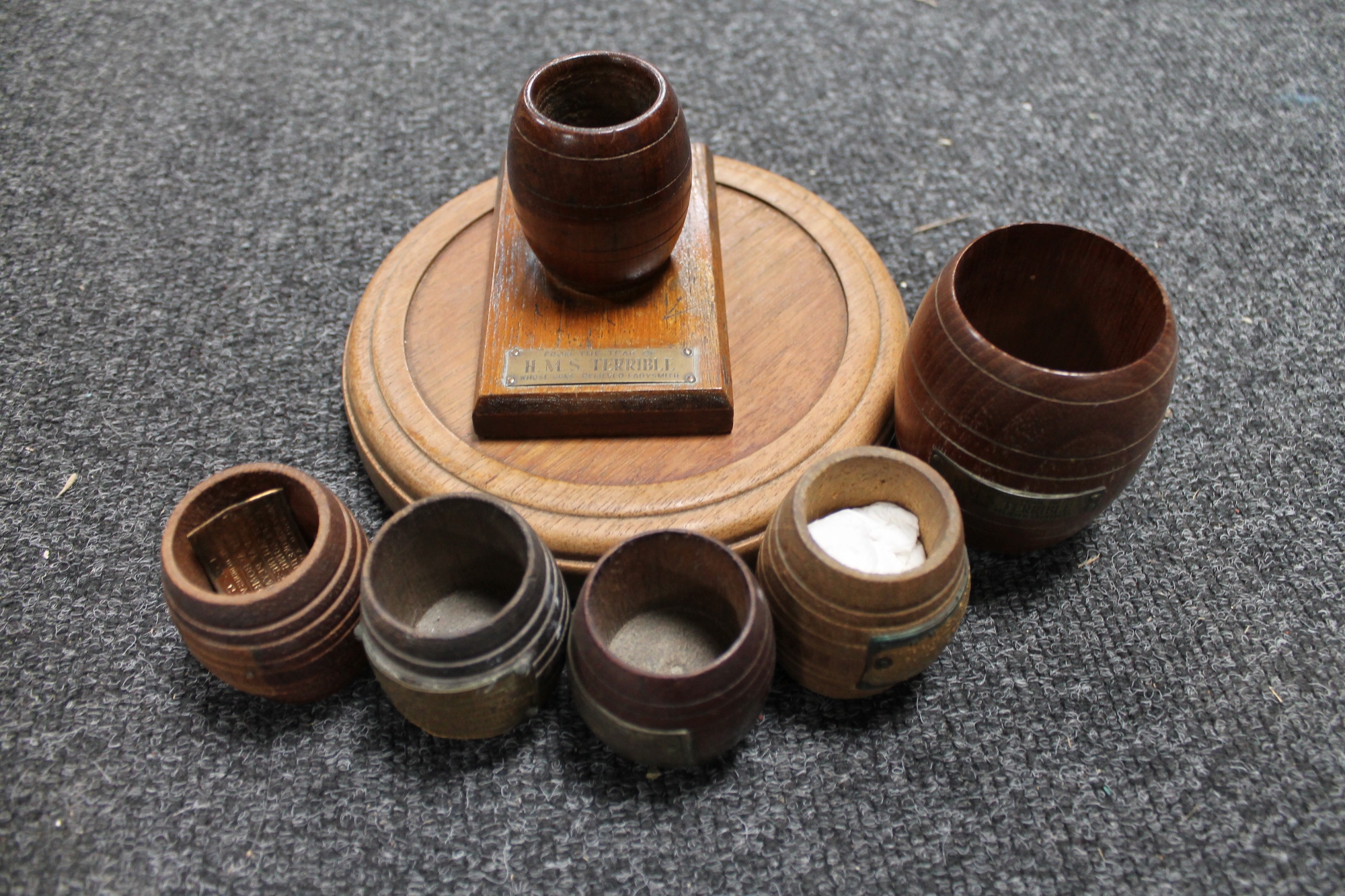 A collection of treen including teak from HMS Terrible