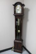 A Tempus Fugit longcase clock with pendulum and weights