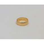An 18ct gold band ring, size J CONDITION REPORT: 3.4g.