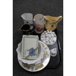 A tray of assorted whisky jugs, china thimbles on stand, two Villeroy and Boch ceramic plaques,