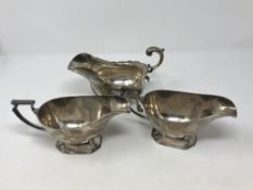 Three silver sauce boats by Walker & Hall,